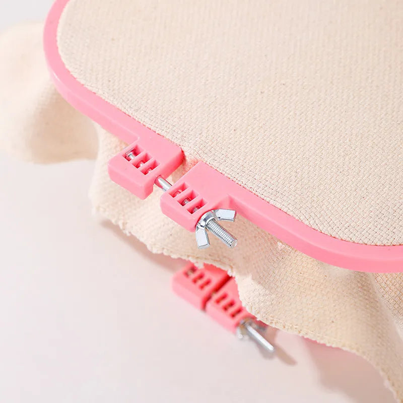 French desktop embroidery frame with adjustable double-layer ABS design in light purple on a table