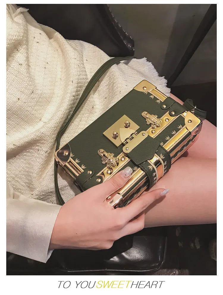 Women's black or green hard flap top shoulder bag made of PU leather with rivet details.