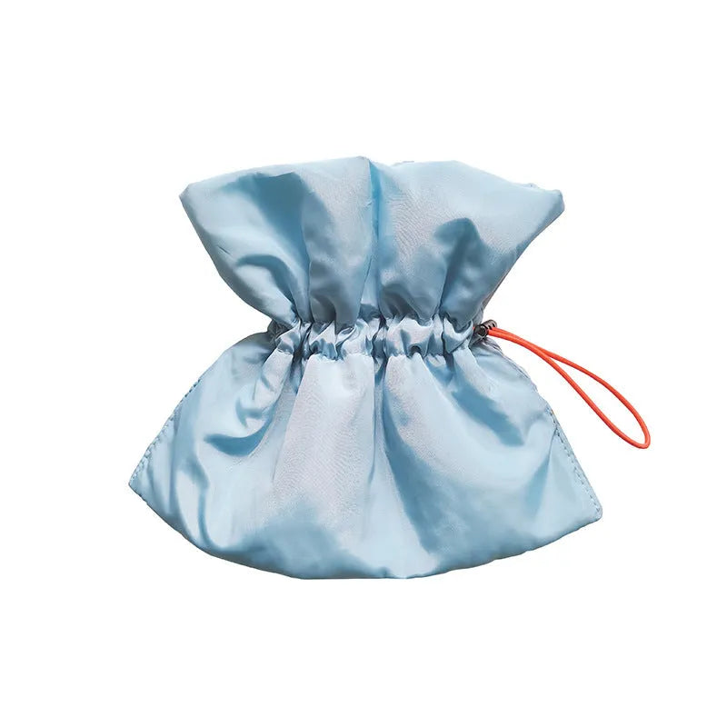 Soft adjustable light blue pet recovery collar with elastic buckle shown on a cat model.