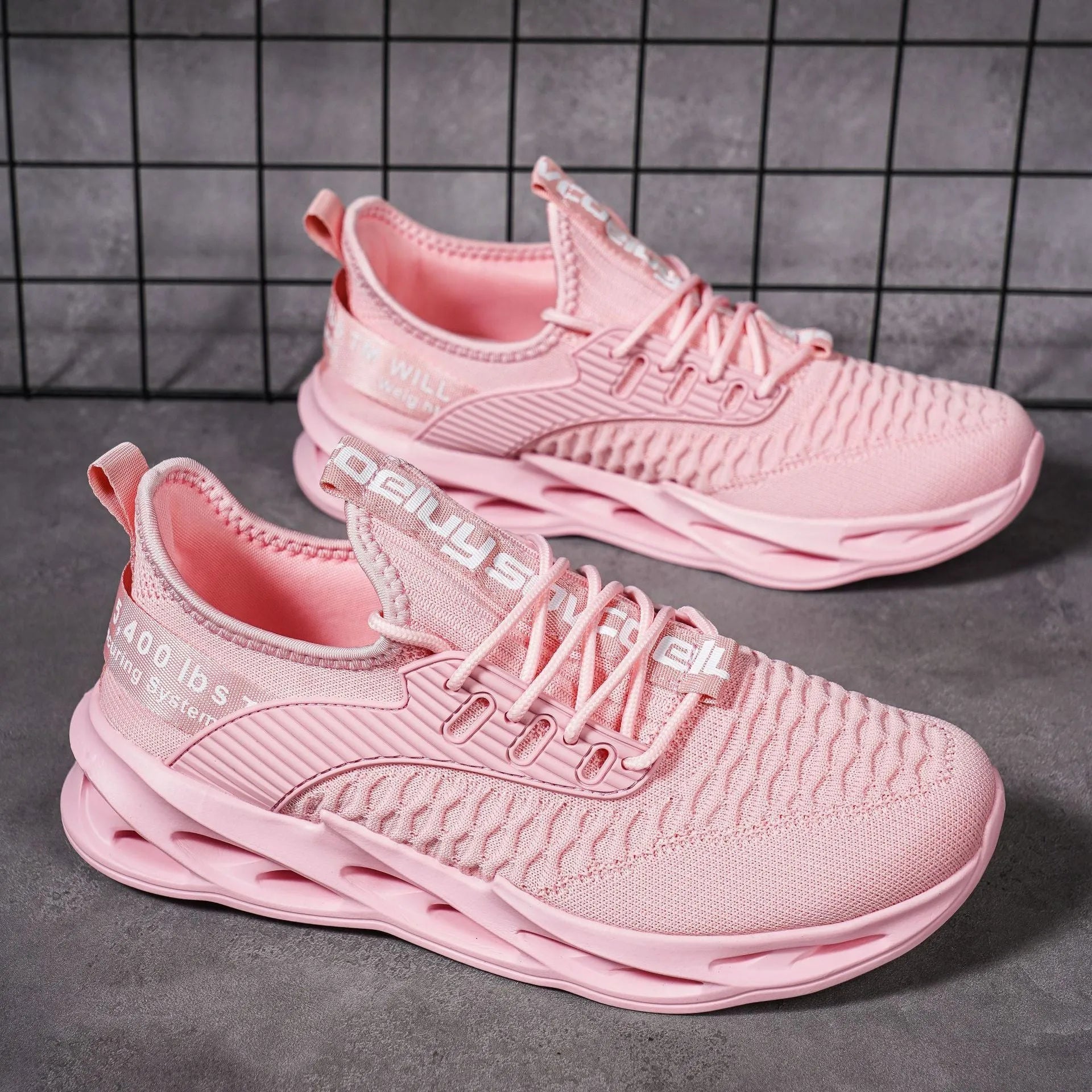Women's FlyKnit casual shoes in a solid colour with mesh upper and round toe.