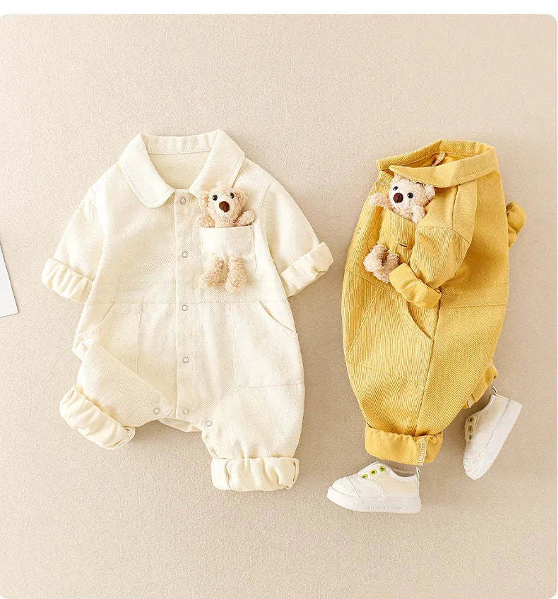 Baby boy wearing blue denim jumpsuit with teddy bear accessory, western style for Spring Festival