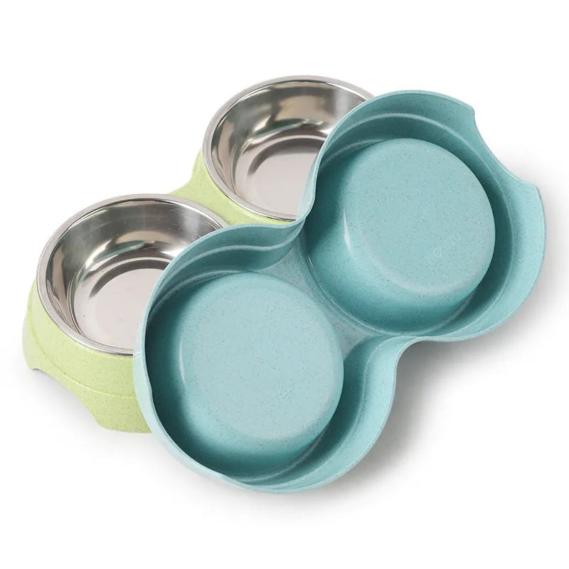 Round two-in-one dog bowl with straw in blue, green, and pink colours measuring 24.5 x 13.5 x 4.6 cm