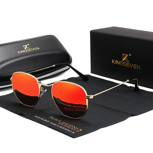 Classic round metal frame sunglasses for men in gun grey colour with UV400 lenses on a table.