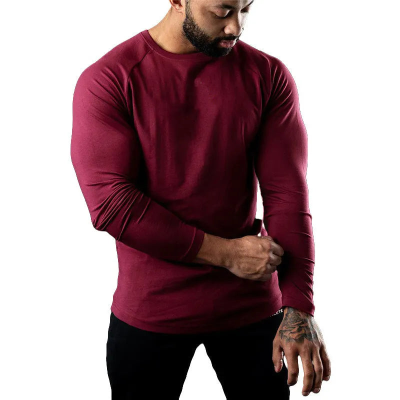 Men's long sleeve cotton sports t-shirt in army green colour, shown with a round neck and tight fit.