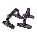 Two black I-shaped push up bars with grey PP sponge handles on a floor.