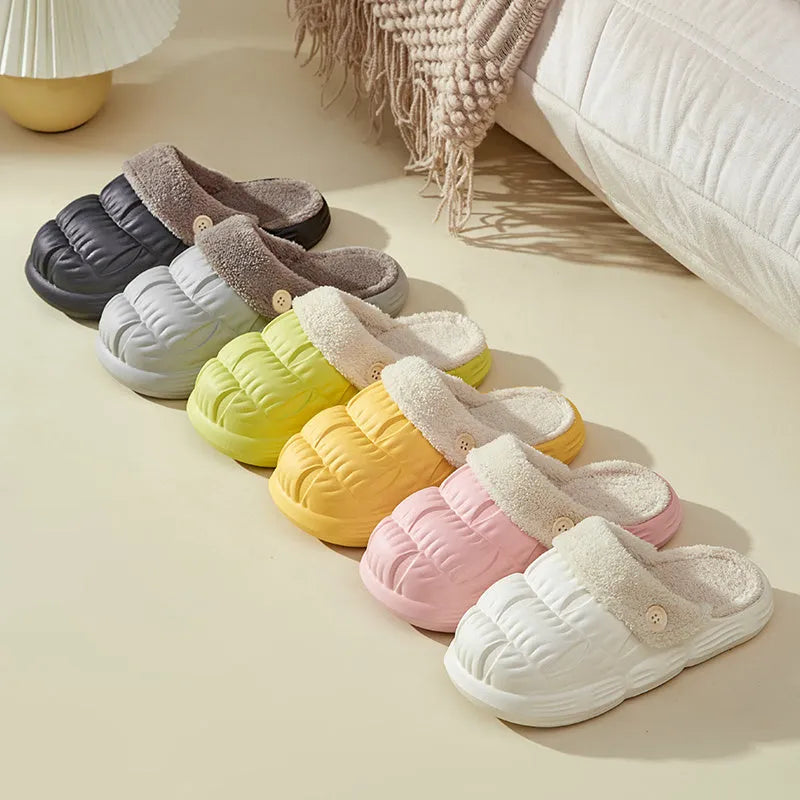 Removable fluffy slippers in beige with faux fur lining and Velcro fastening on a wooden floor