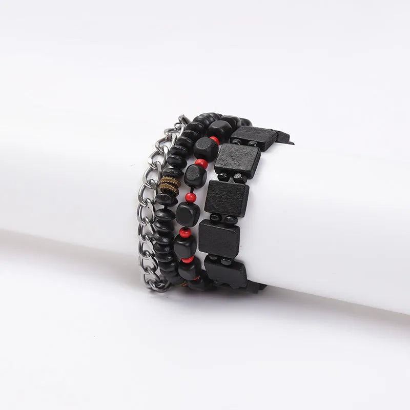 Retro woven alloy men's beaded bracelet set with four different coloured bracelets on a white background