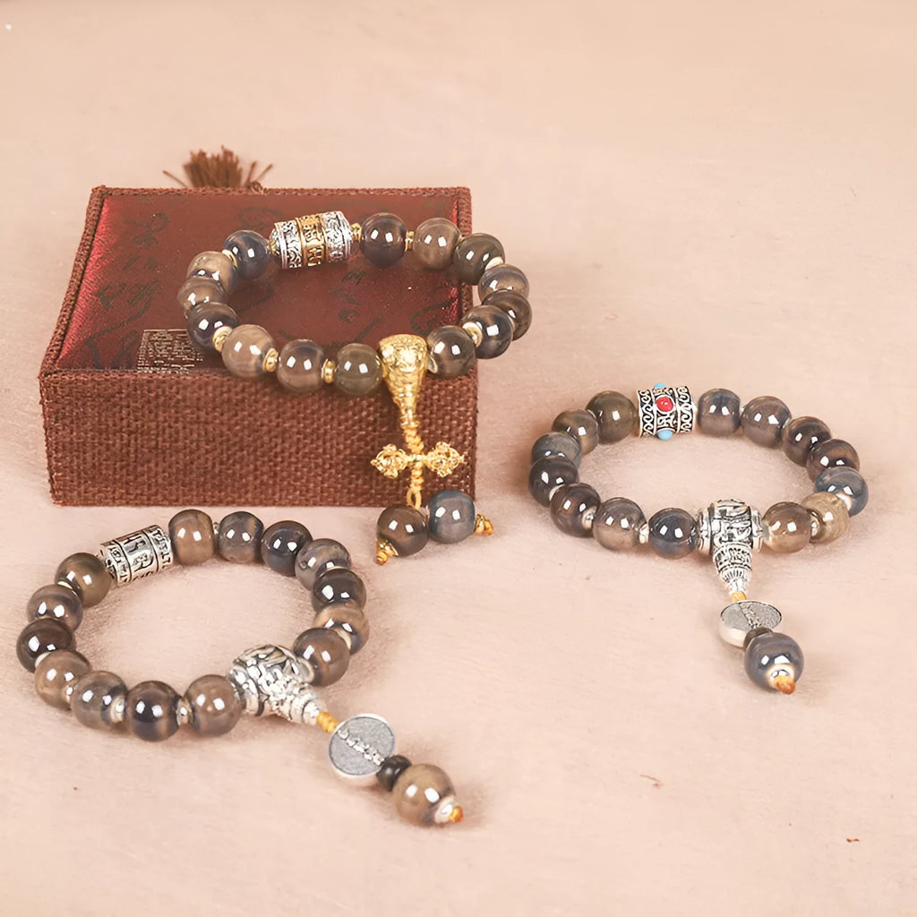 Men's gradient ceramic Yonghe blessing bracelet with coloured glaze beads on a wrist.