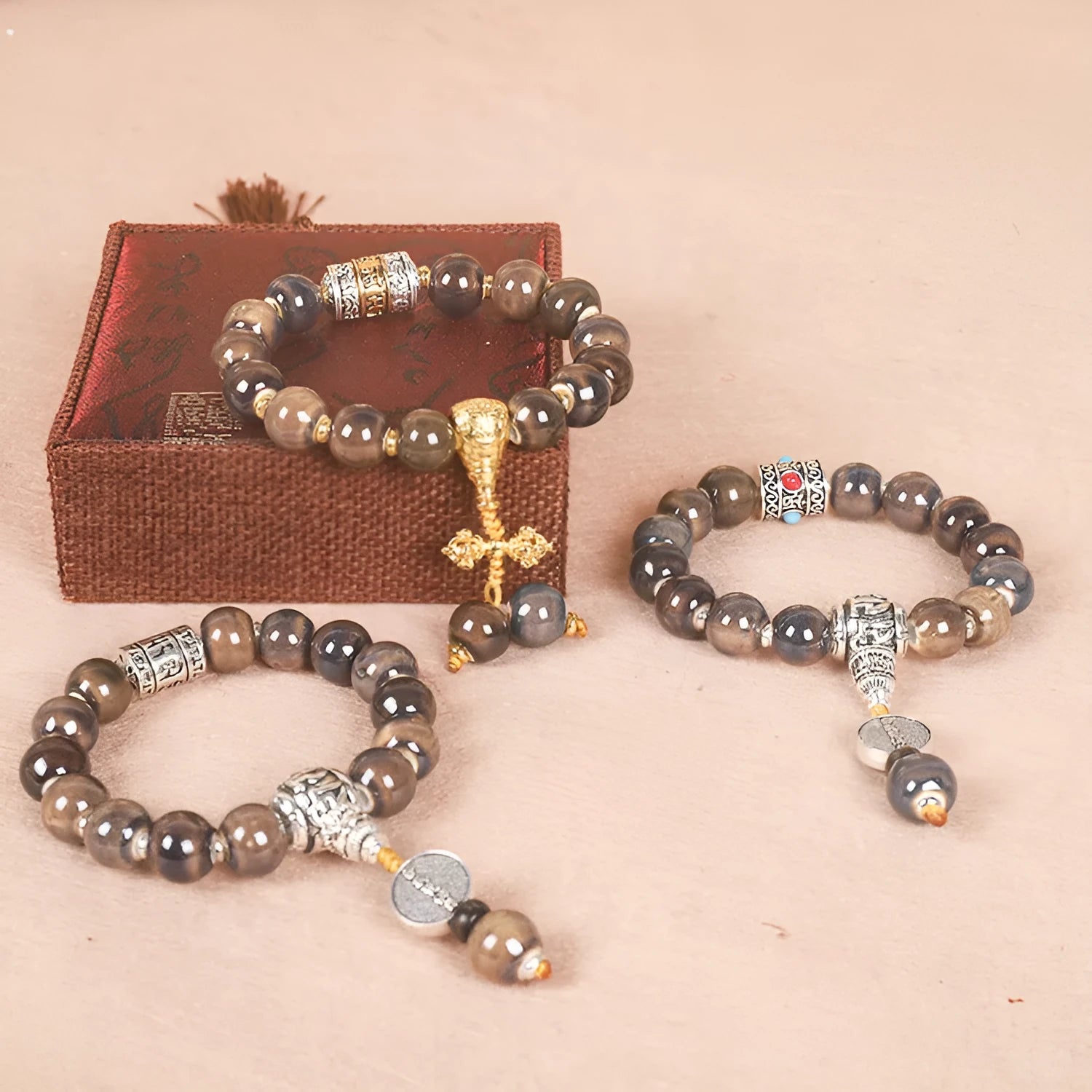 Men's gradient ceramic Yonghe blessing bracelet with coloured glaze beads on a wrist.