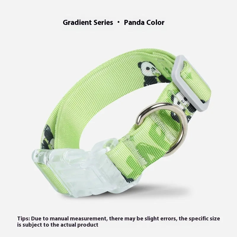 Adjustable nylon dog collar with vibrant cartoon gradient print and metal D-ring on a green background.
