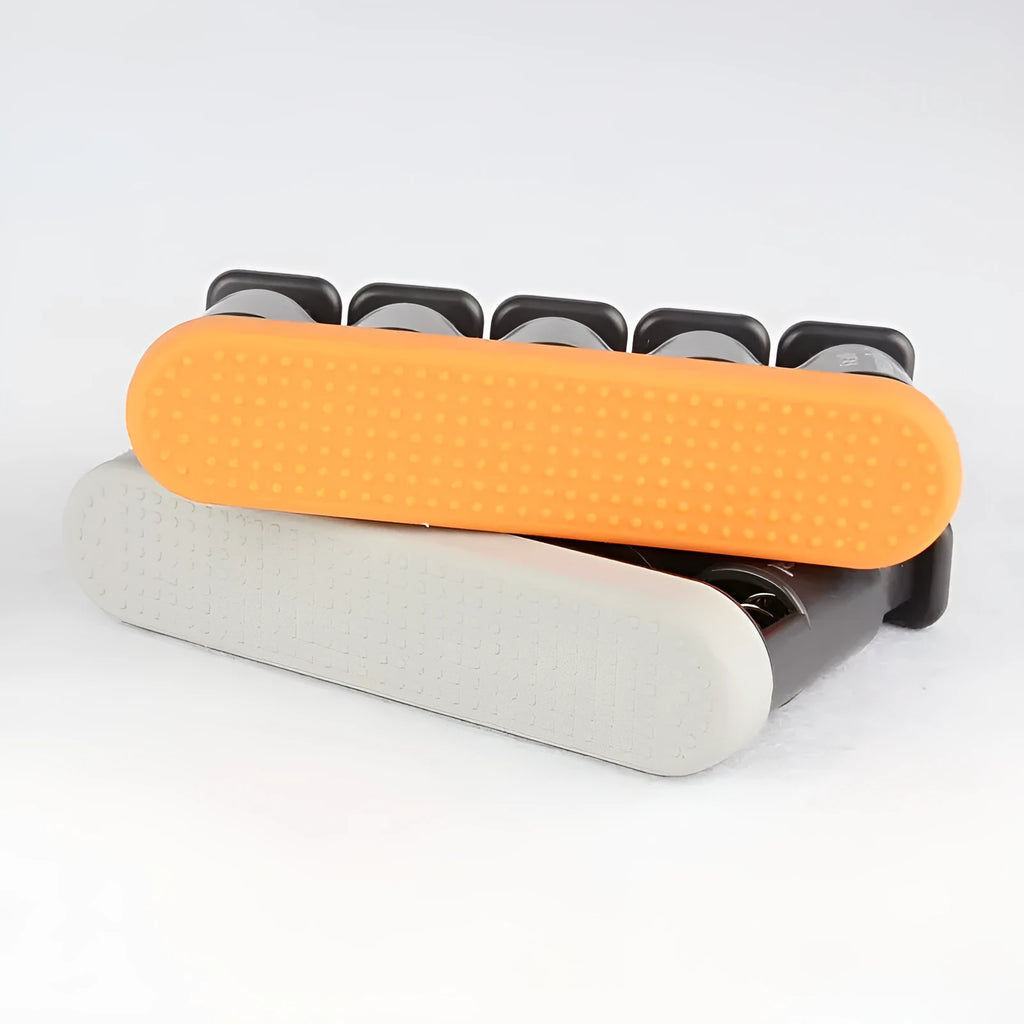 A grey and orange non-slip silicone finger trainer for musicians and climbing.