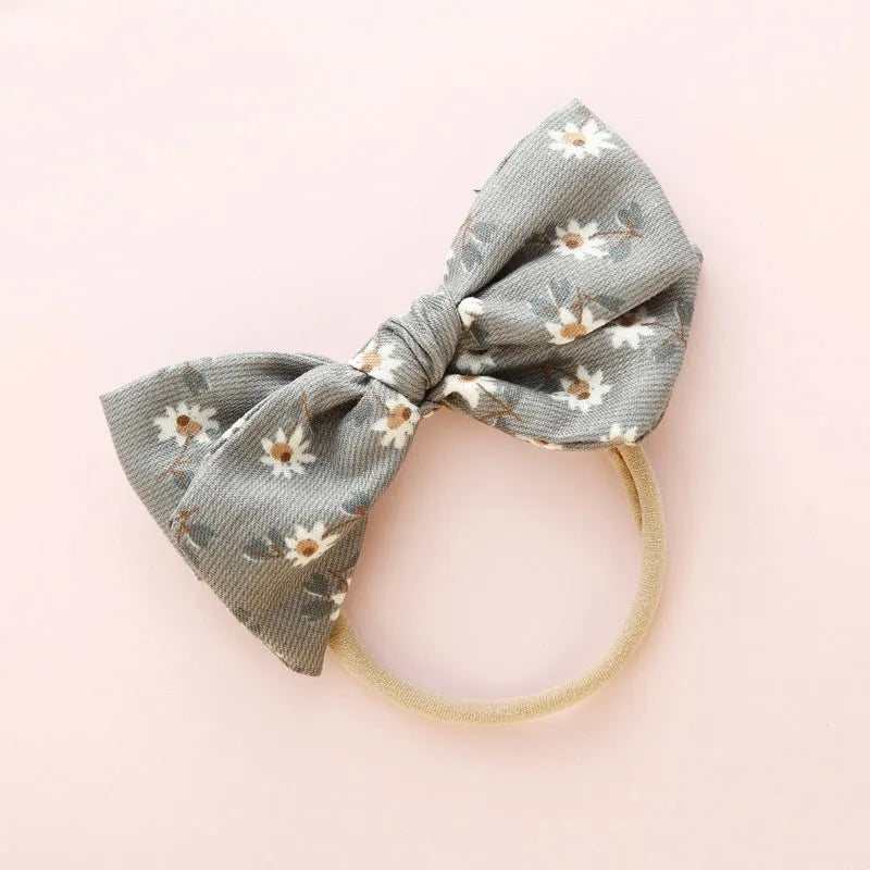 Children's cloth knotted bow hair ring in a Snow White princess design.