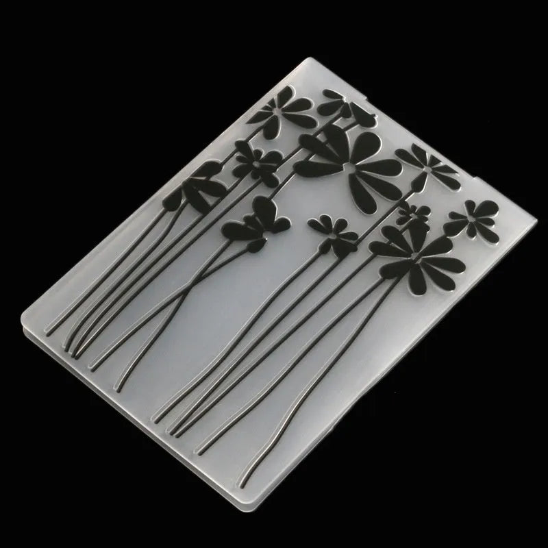 Plastic cake decorating mould showing windmill and flower shapes, folding size 14.5 by 10.5 cm.