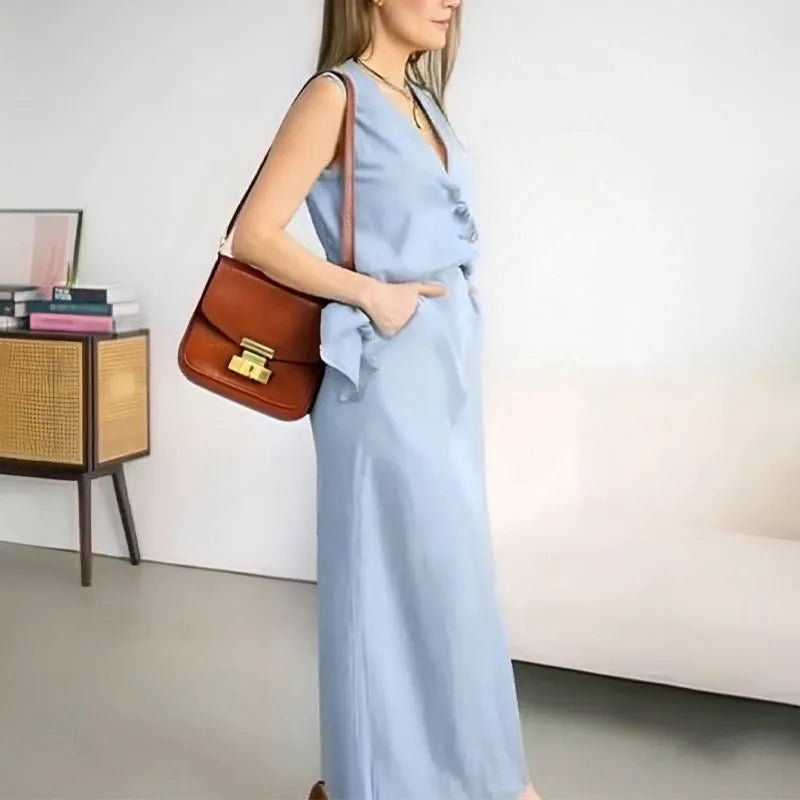 Women's blue casual two-piece set featuring a sleeveless vest and a long, loose-fitting skirt.