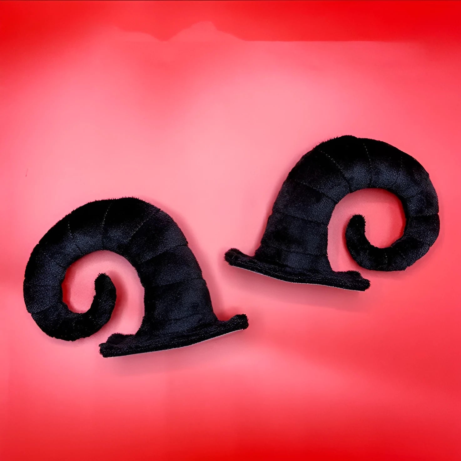 A pair of composite fibre horn decorations for a motorcycle helmet, shown in one of four colour options.