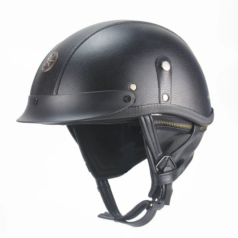 Retro black leather motorcycle helmet with a half-visor on a background.