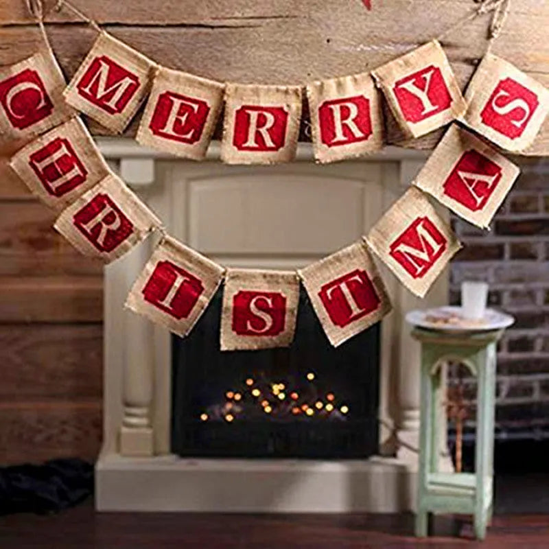 Two brown and red burlap Christmas banners with sackcloth flags hanging against a rustic backdrop.
