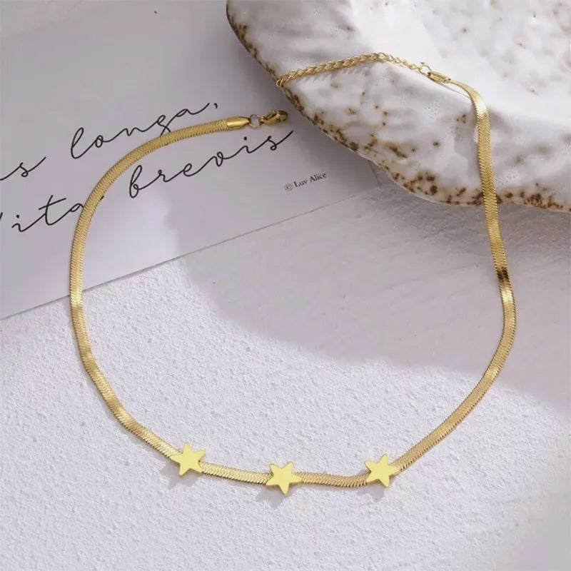 Gold gothic star pendant choker necklace on titanium steel snake chain, 41-50cm adjustable length.