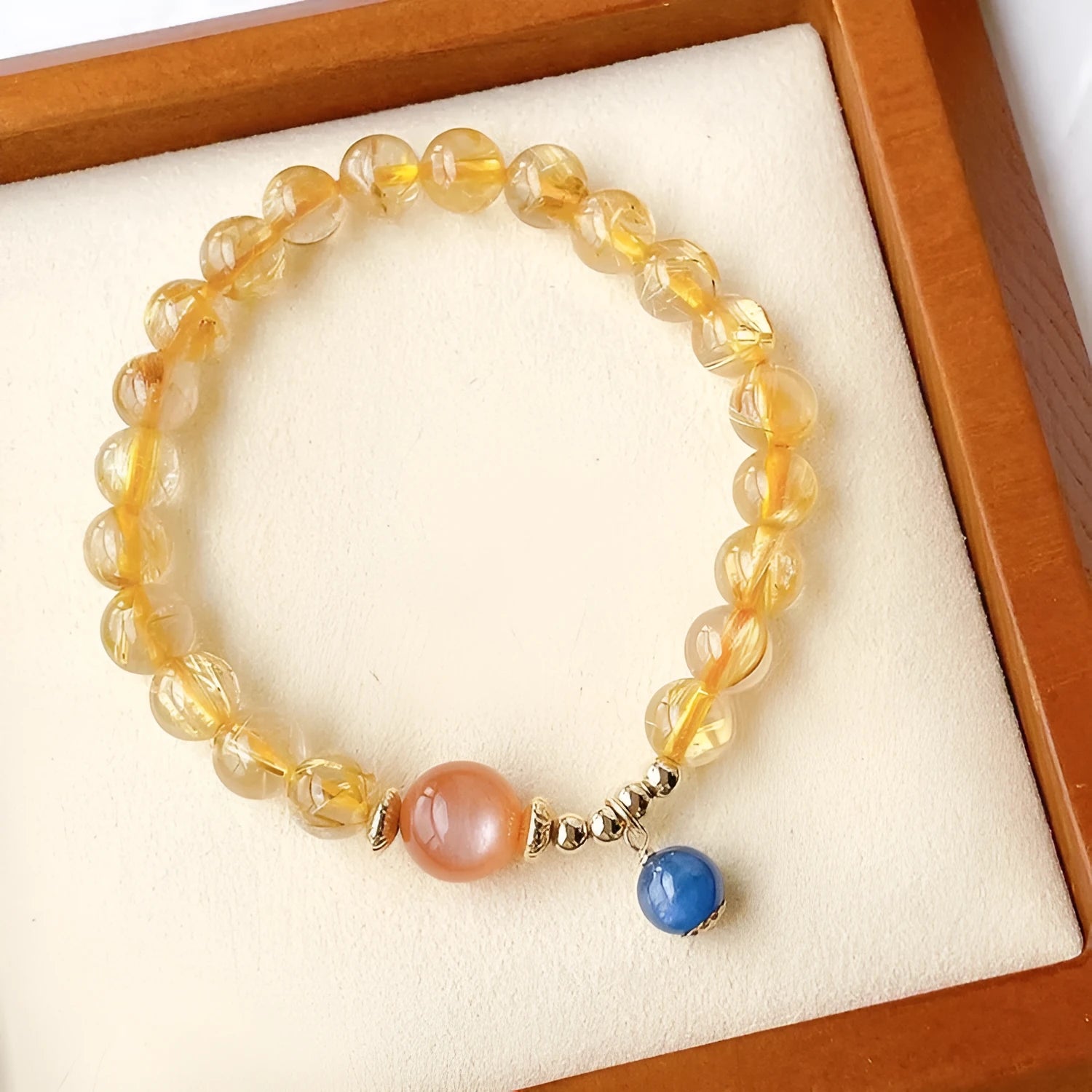 Handcrafted natural gold rutilated quartz sunstone bracelet with diamond-shaped and round crystal beads for women