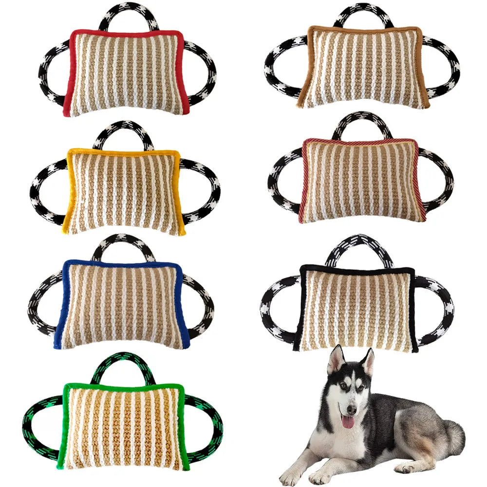 Dog tug of war toy with blue jute bite pillow and three rope handles on a wooden floor.