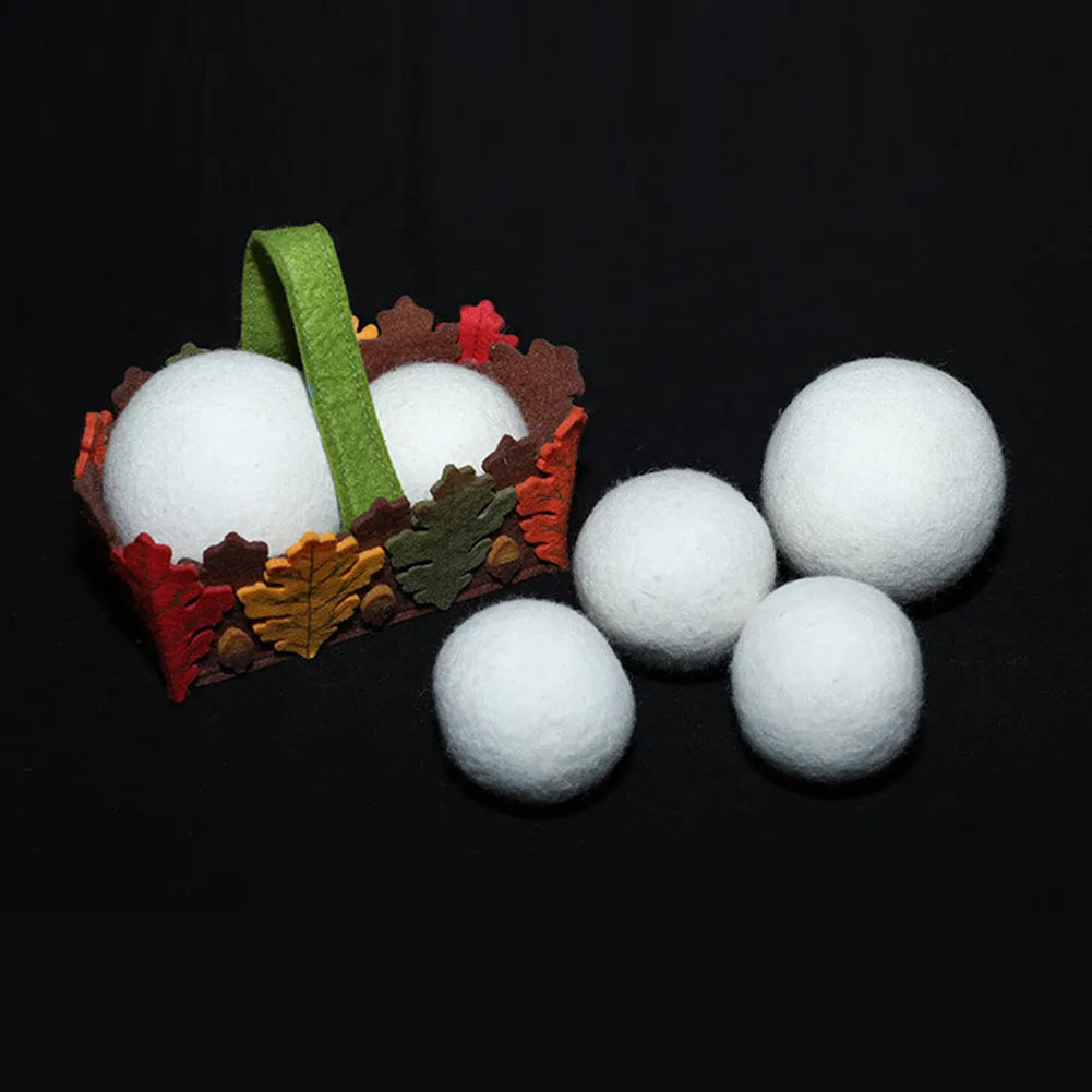 Wool laundry drying ball in various sizes with cotton storage bag for tumble dryer use