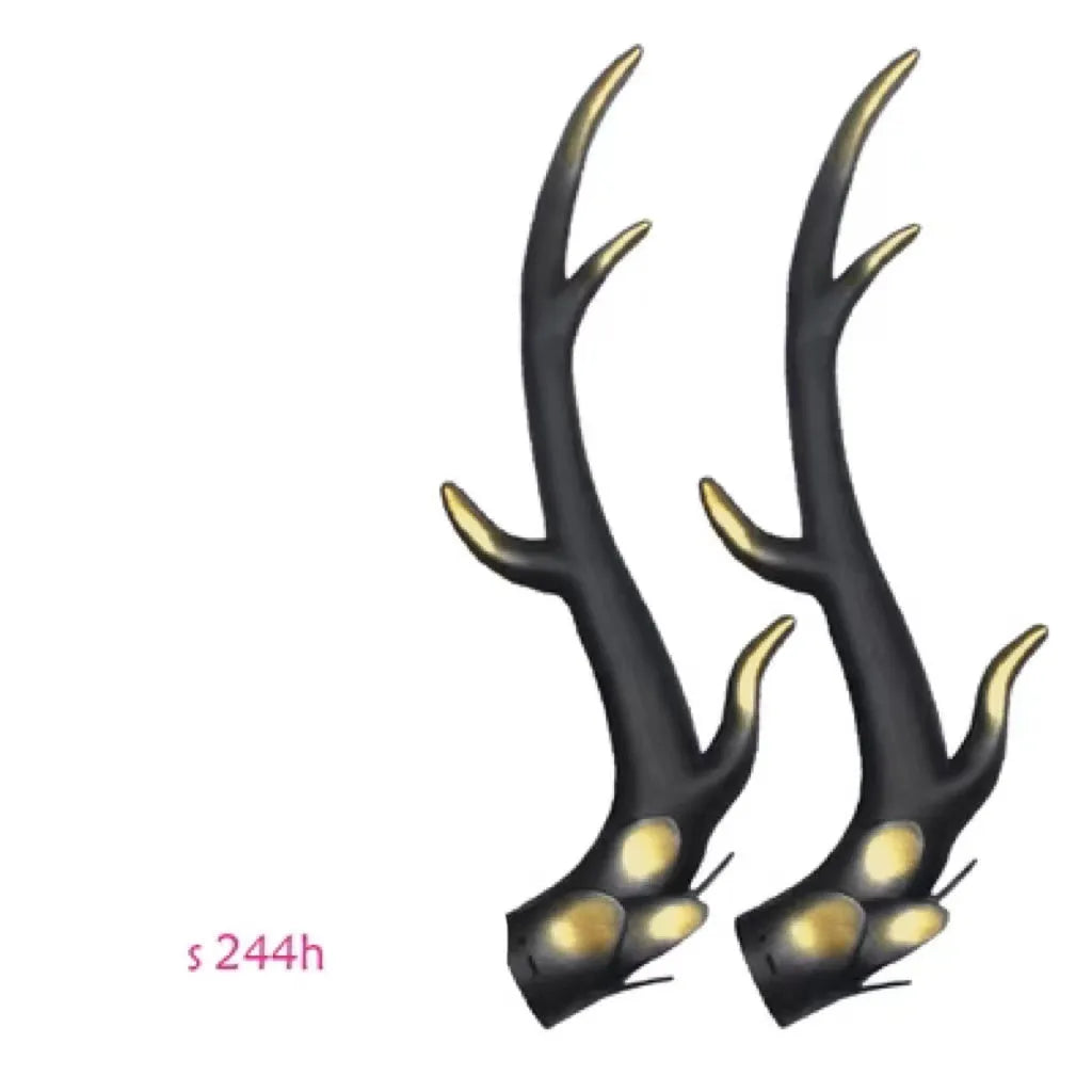 A pair of black resin dragon horn decorations for motorcycle helmet customisation, showing curved shape and mounting base.