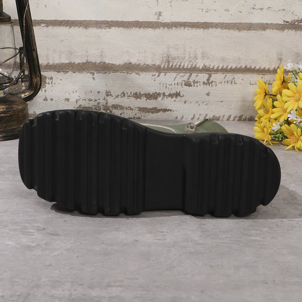 Women's black retro platform Martin boots with chunky heel and side zipper on a three-layer sole