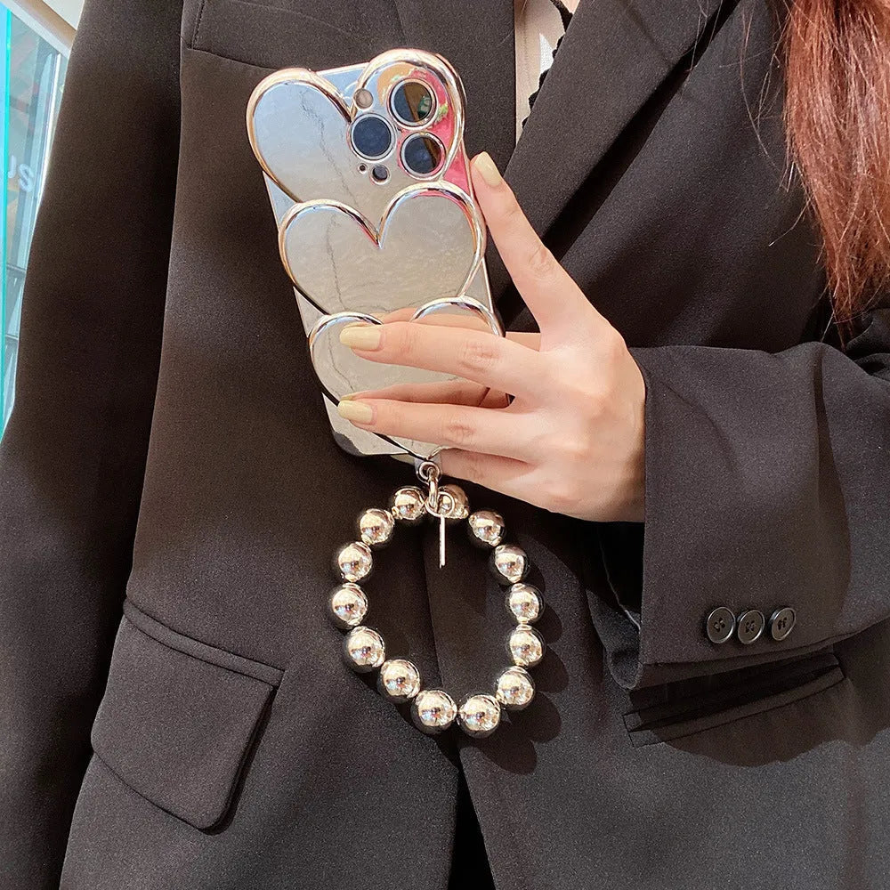 iPhone mobile phone case with shiny silver electroplated love design on a solid colour soft TPU back cover.