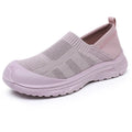 Women's black slip-on shoe cover with breathable cloth upper and flat PVC sole.