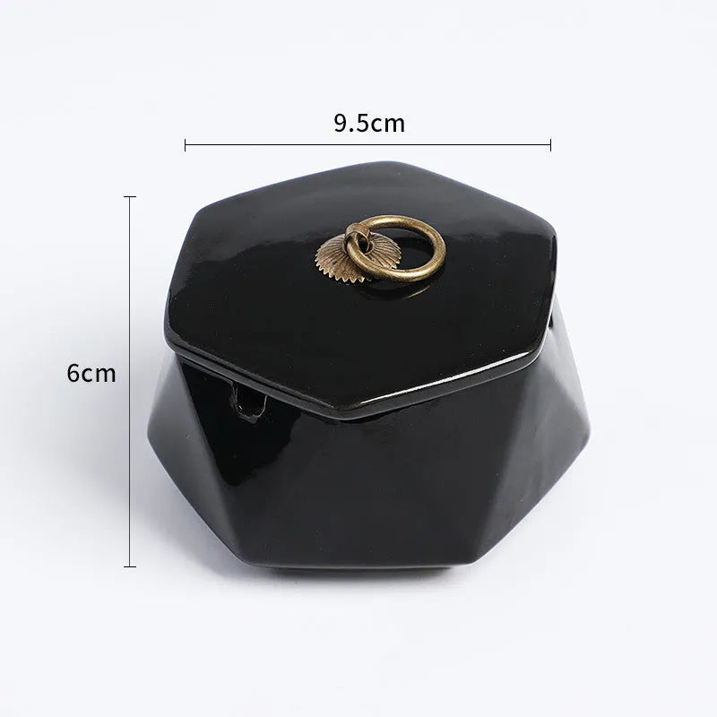 Ceramic ashtray with lid, Nordic style, available in multiple colours, on a tabletop