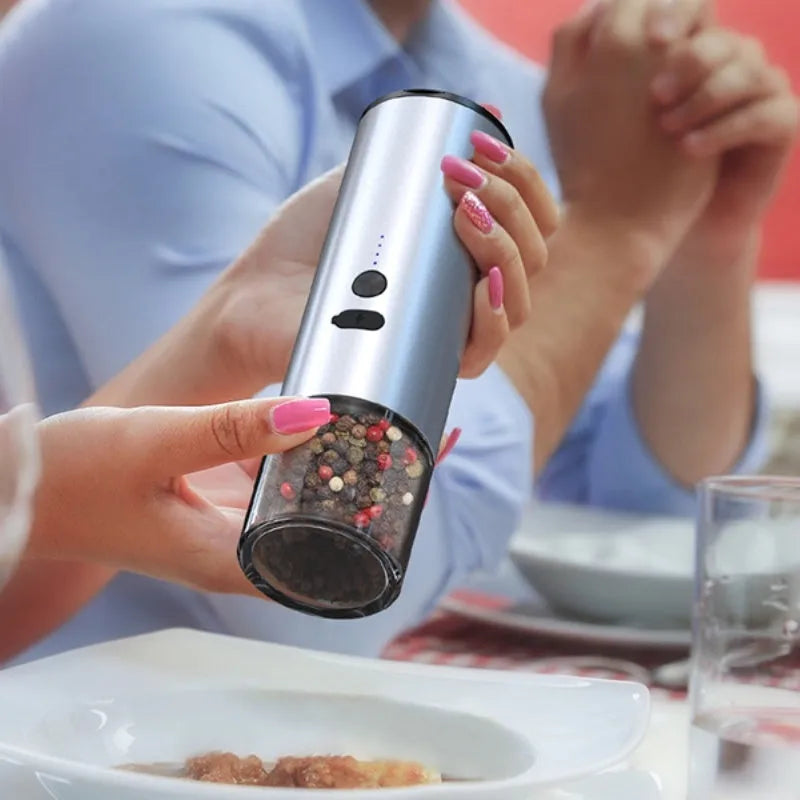 White and black electric salt and pepper grinders with USB port and clear glass jars.