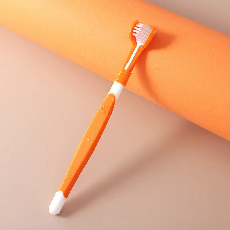 Pet toothbrush with soft nylon bristles on a plastic handle in various colour options for dogs and cats