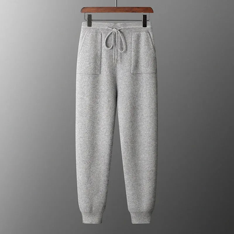 Men's light grey cashmere hooded sweatshirt and trouser set laid flat