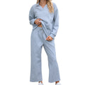Women's solid colour knitted jacquard trouser suit with long sleeve top and cropped pants.