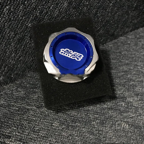 Aluminium alloy oil filter cap for Honda vehicles in assorted colours on a dark background.
