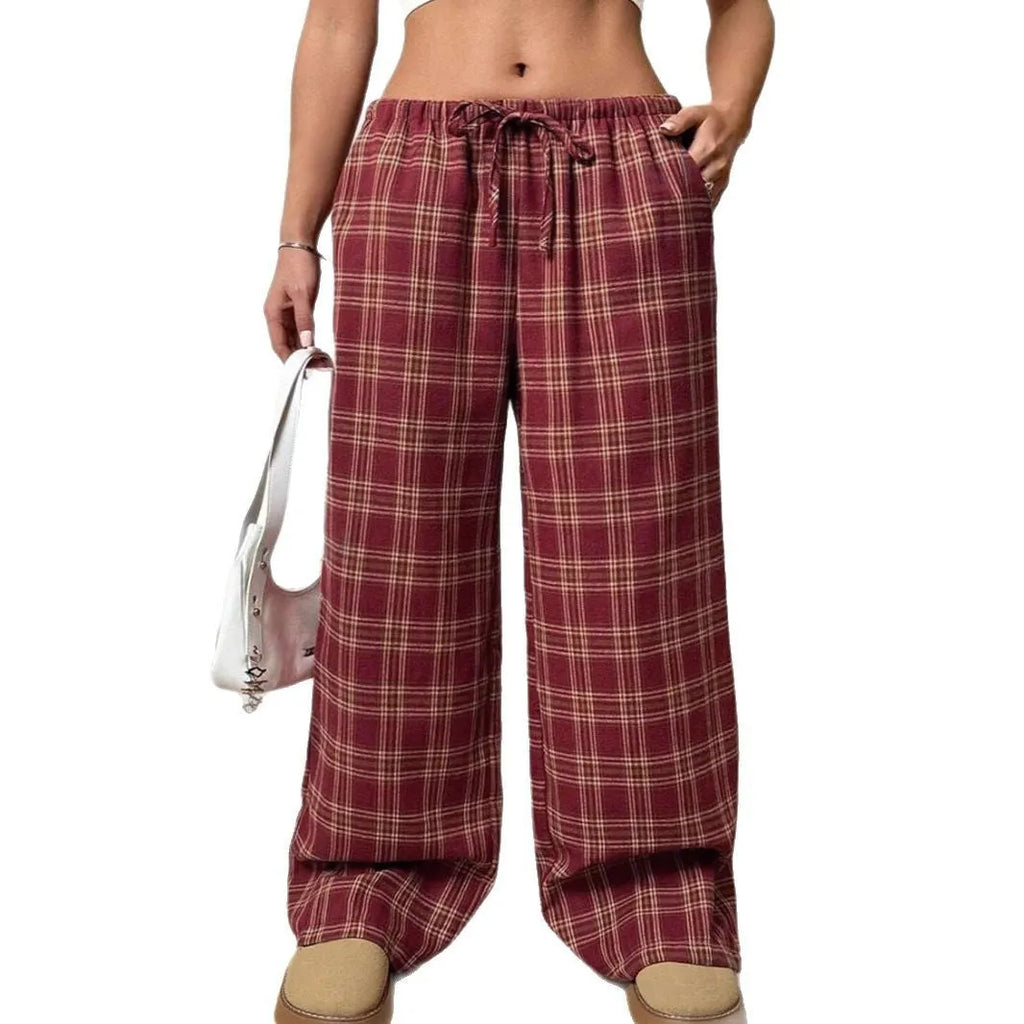 Women's red and blue plaid casual trousers with a drawstring waist and side pockets.