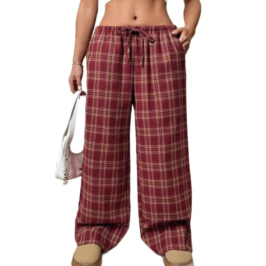 Women's red and blue plaid casual trousers with a drawstring waist and side pockets.