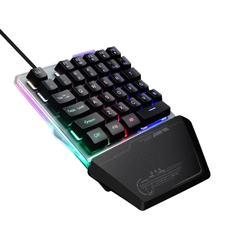 Black G40 Flow one-handed mechanical keyboard with RGB backlit keys on a desk.
