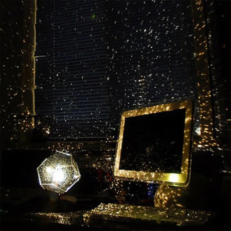 LED starry sky projector night lamp on a table projecting constellations onto a dark bedroom ceiling.