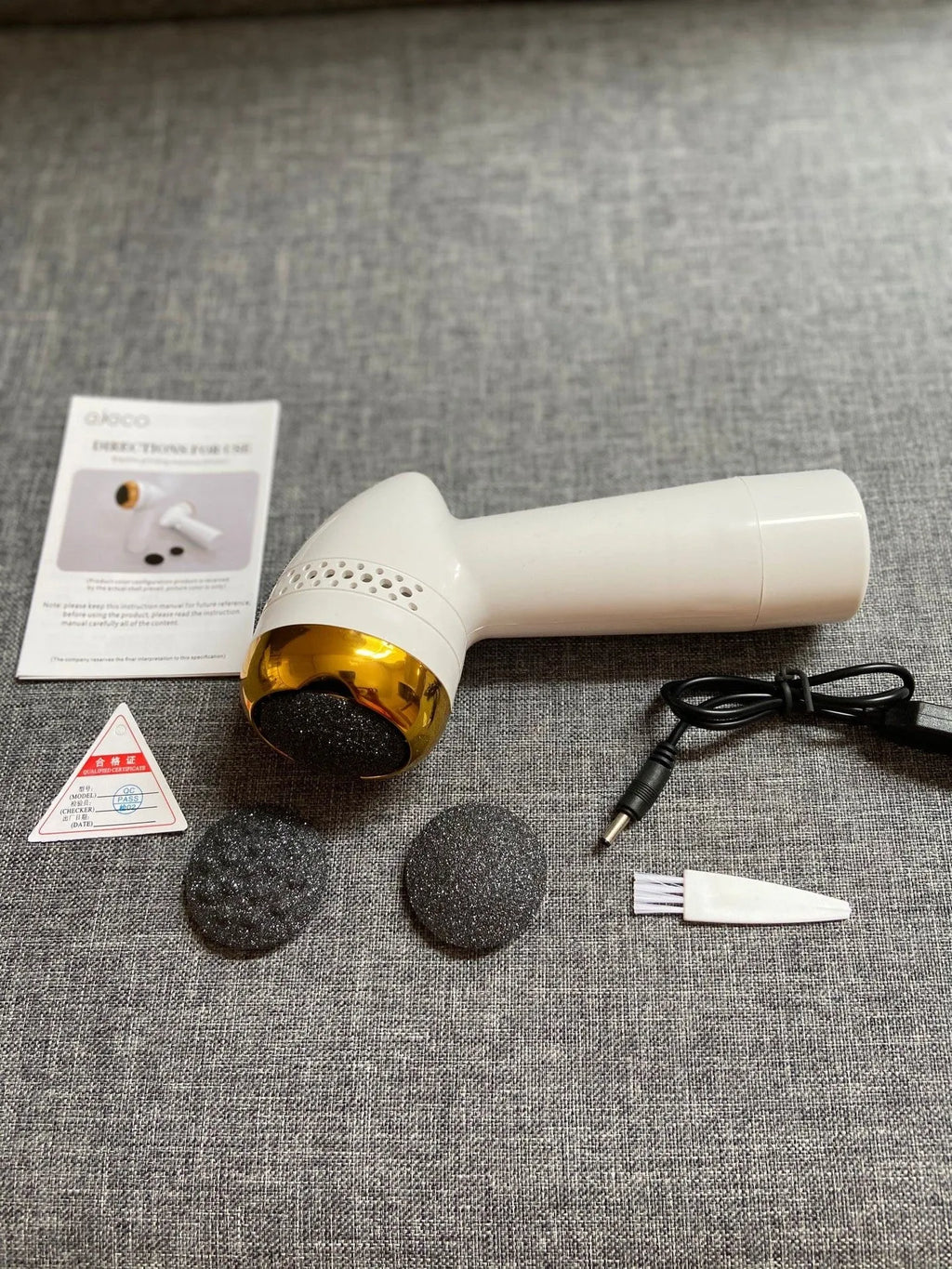 Handheld electric foot grinder with quartz head in gold, pink gold, and white silver colour options.