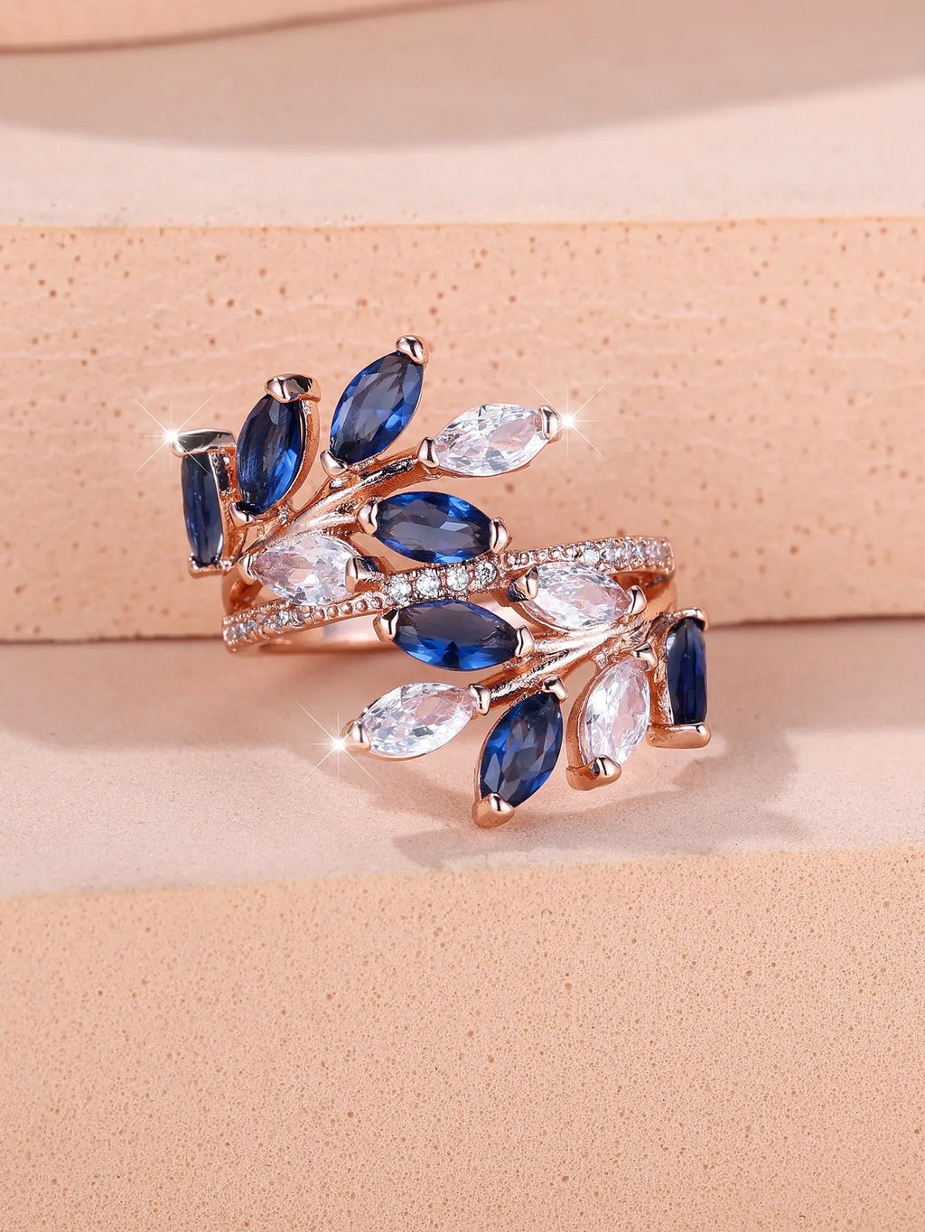 Copper leaf-shaped adjustable ring with Platinum sapphire blue finish