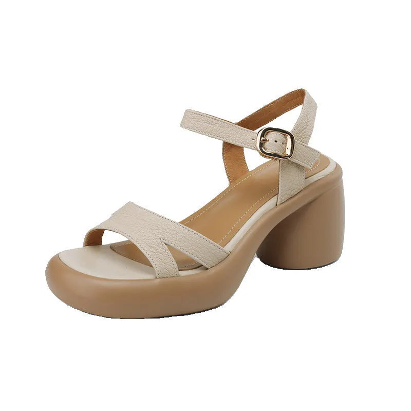 Women's apricot open-toe platform sandals with round toe holder and a light-coloured rubber sole on a plain background.