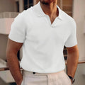 Man wearing a slim fit black heavy waffle knit t-shirt with short sleeves.