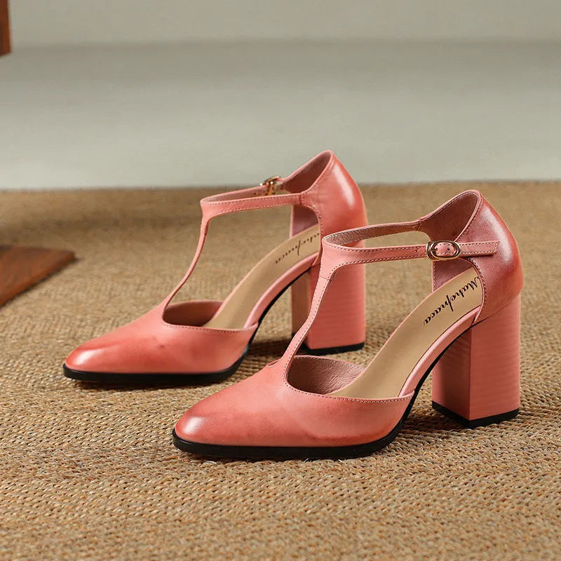 Women's pink and dark brown retro Mary Jane shoes with a pointed toe, buckle, and hollow design detail.