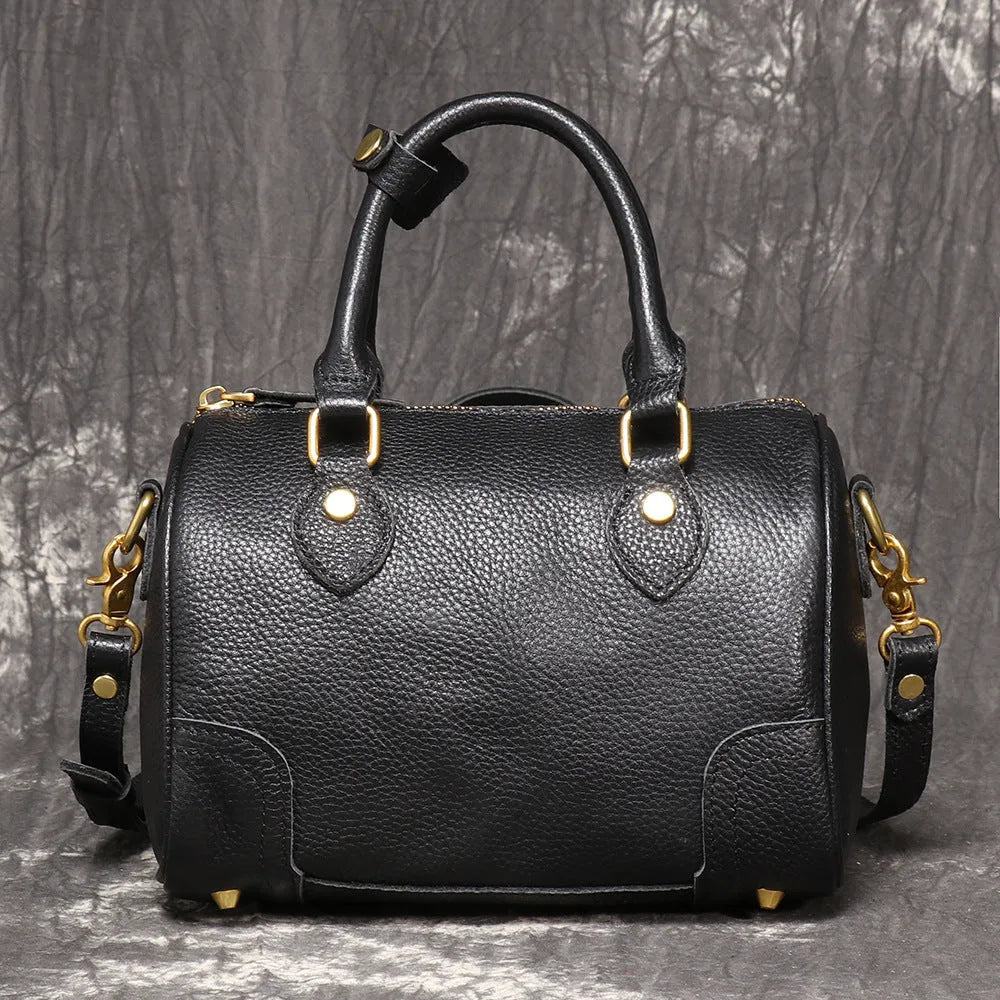 Brown handmade cowhide leather Boston bag with cylindrical shape and single shoulder strap