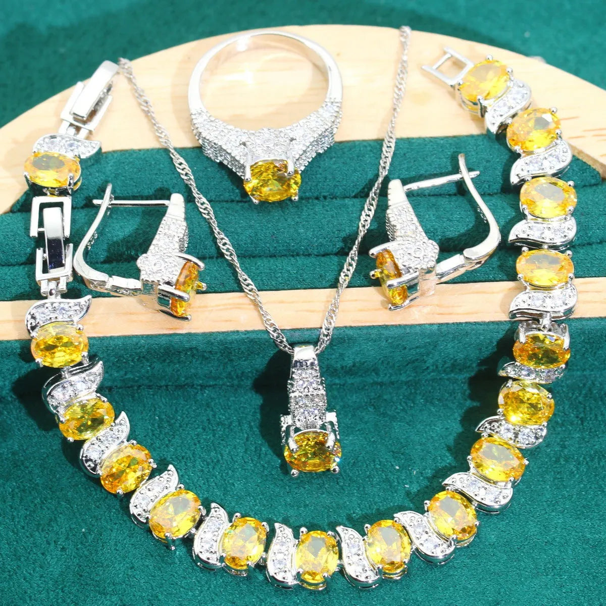 Bridal four-piece zircon jewellery set with necklace, bracelet, earrings and ring in water wave chain design.