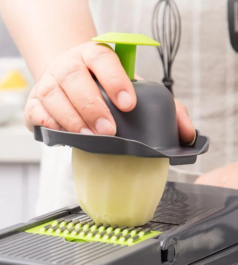 Multifunctional vegetable cutter with 7 stainless steel blades on a kitchen countertop