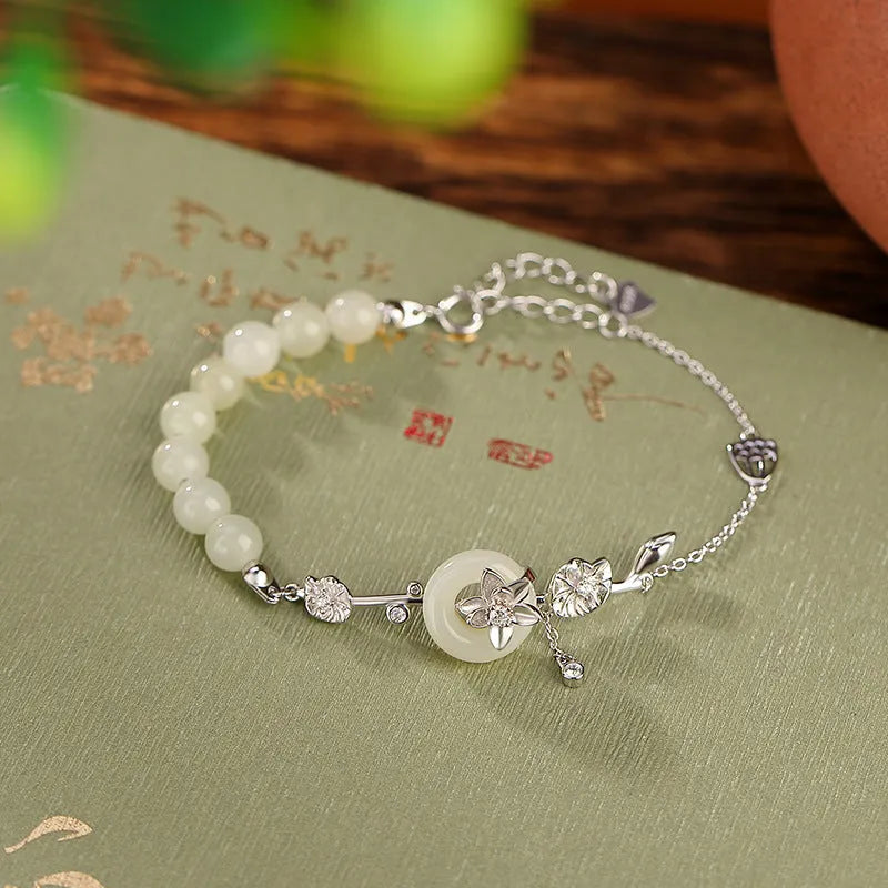 Women's antique bracelet with Hetian jade inlay and lotus peace buckle design in 925 silver