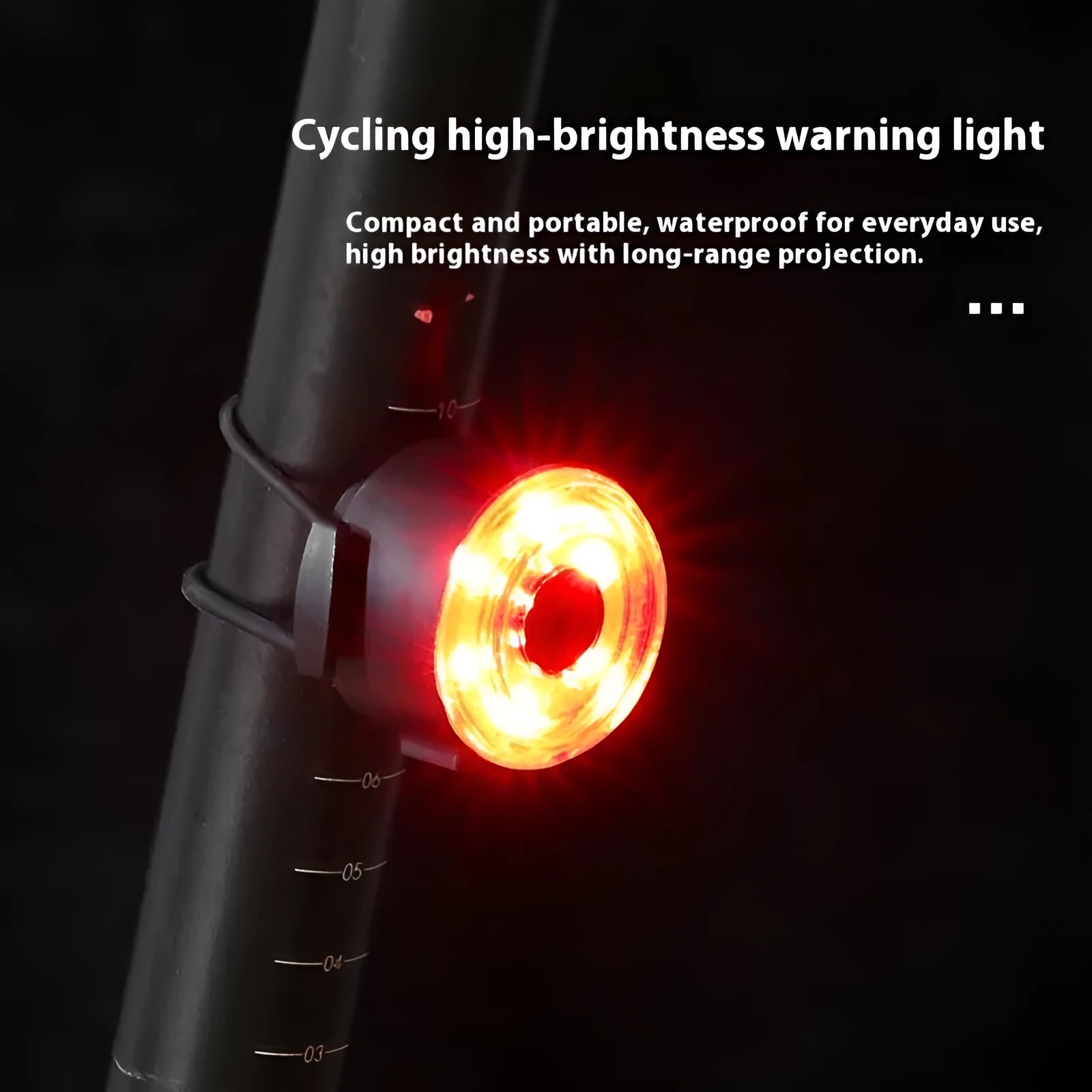 Round red bike warning light mounted on bicycle handlebar with silicone strap for night riding safety