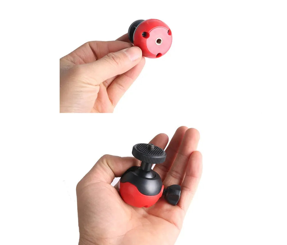 Black octopus tripod with flexible rubber legs wrapped around a pole, holding a mobile phone.